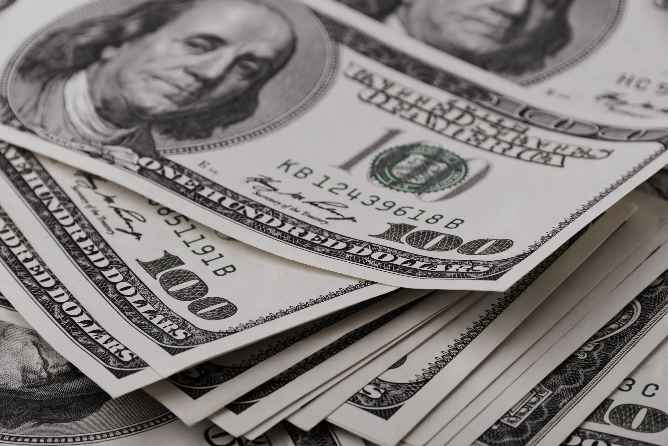 Is Your P&L Missing This? How One Real Estate Team Uncovered $140K in Waste Stack of $100 bills representing financial clarity and improved real estate team profitability.